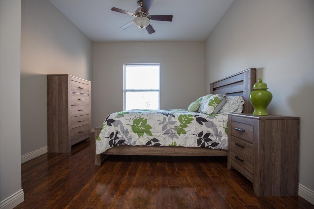 A Cozy Bedroom From The Lofts at the Manor Luxury Apartments for Young Professionals in Columbia, MO