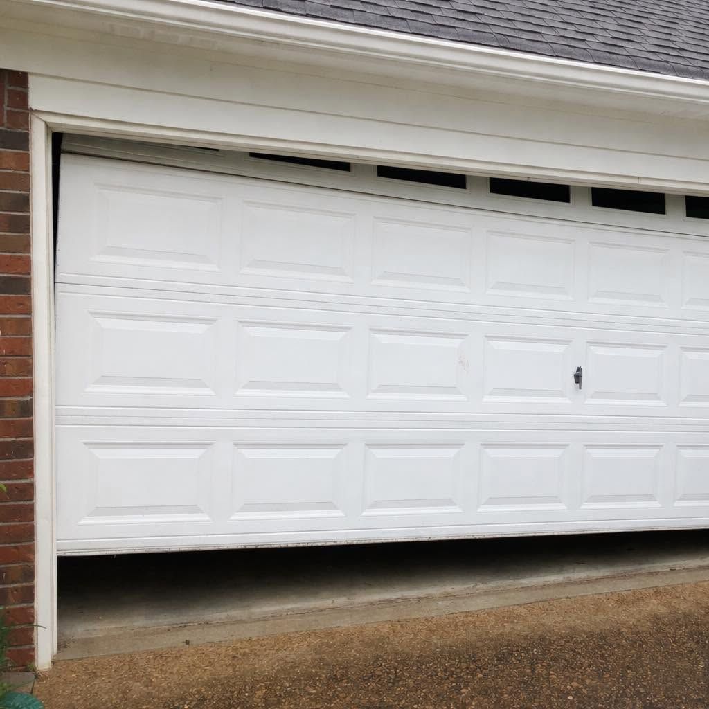 residential garage door out of alignment