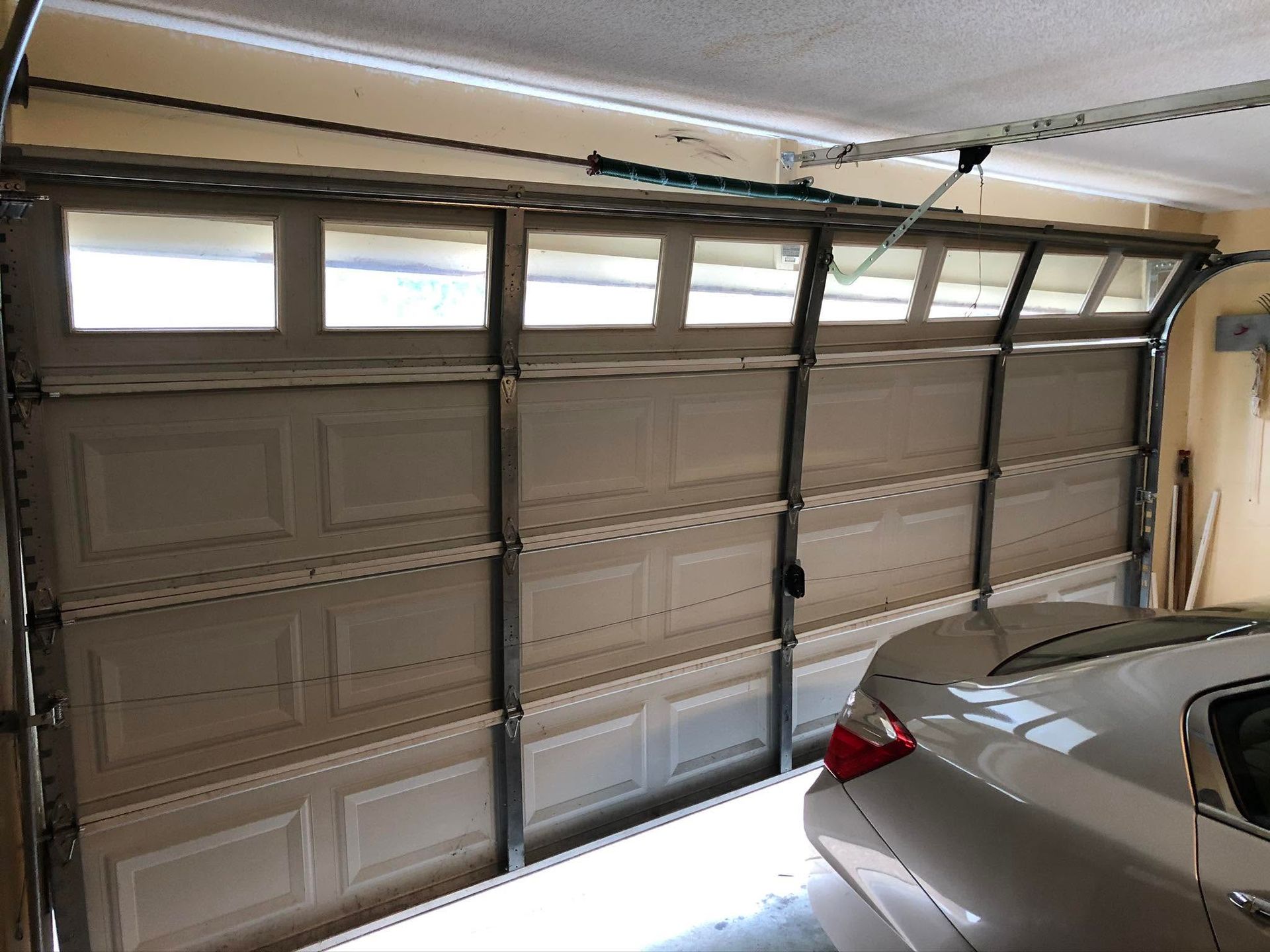 residential garage door out of alignment