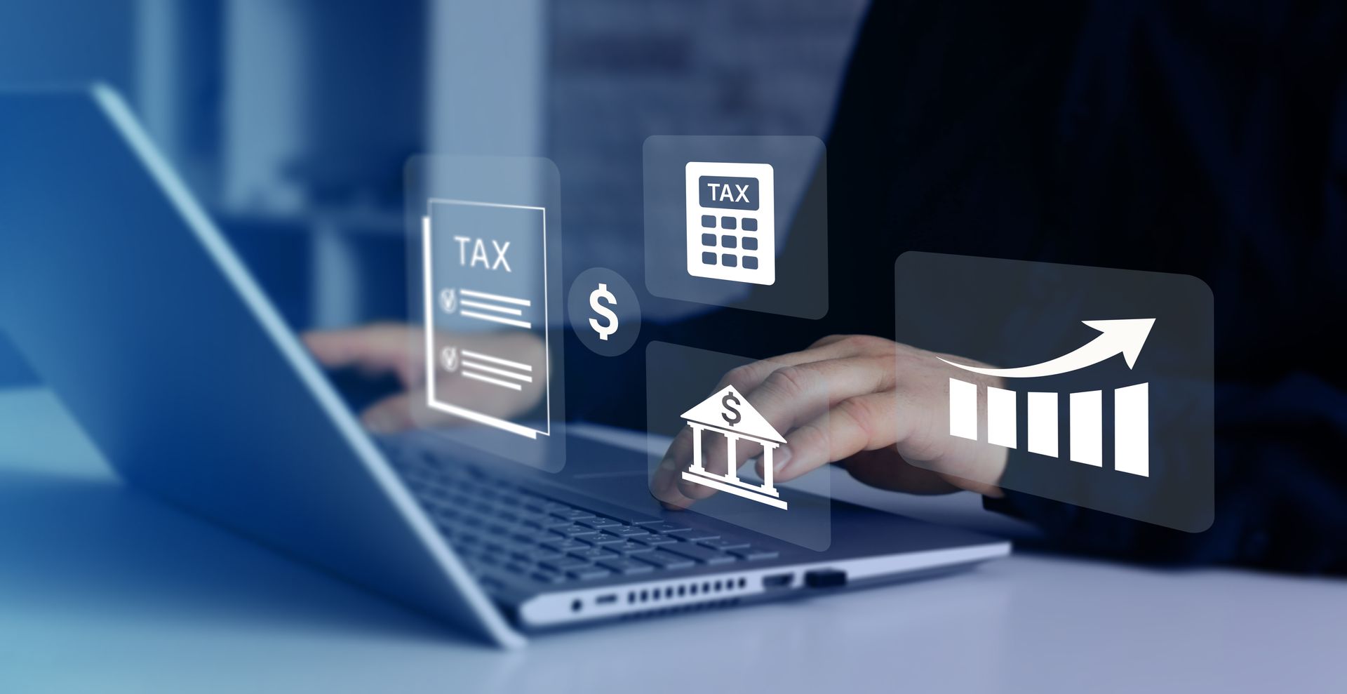 Laptop with finance icons, tax document, calculator, and rising bar chart over a hand typing on a keyboard Laptop with finance icons, tax document, calculator, and rising bar chart over a hand typing on a keyboard