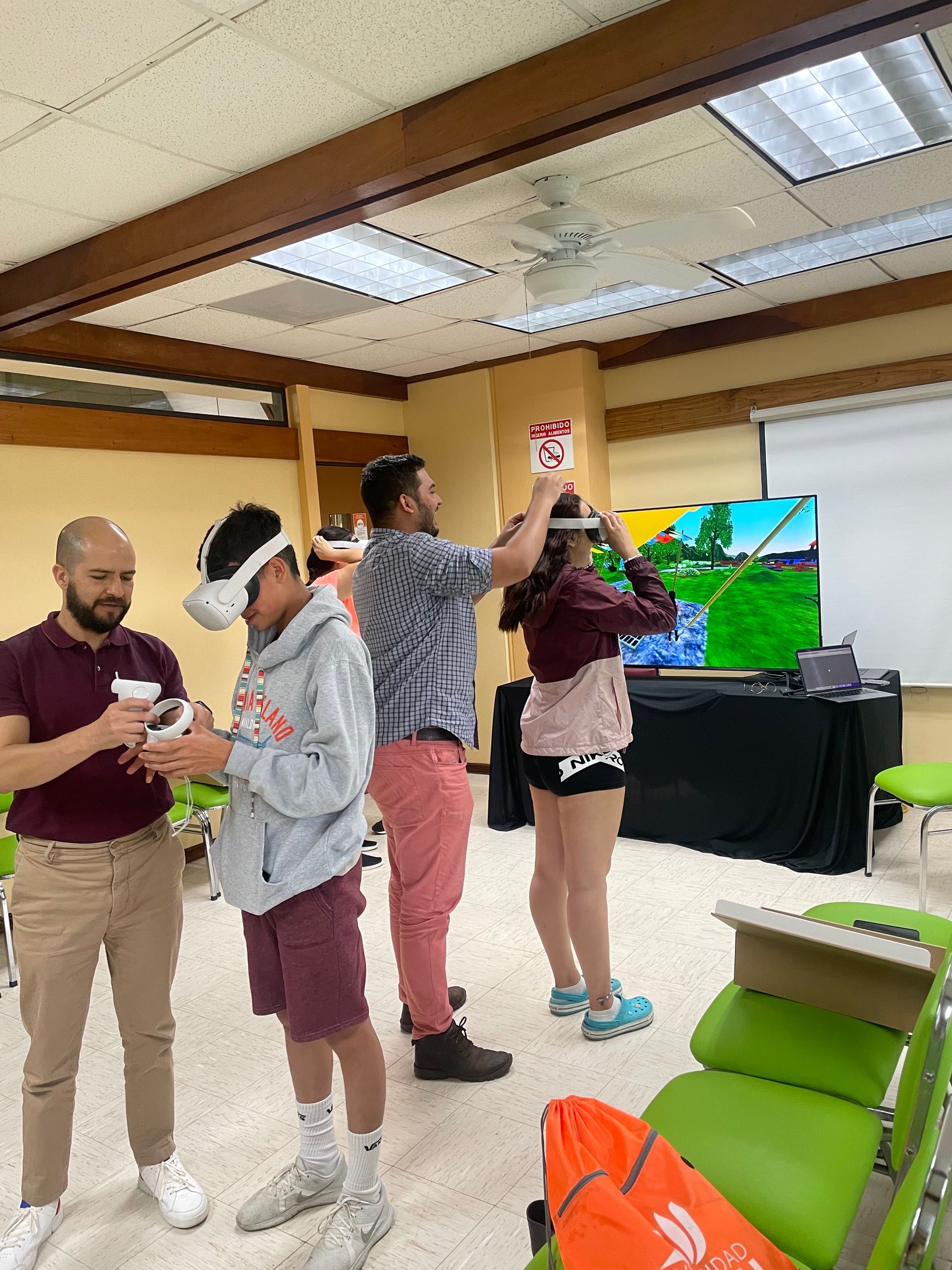 A group of people are playing a video game in a room.