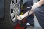 Mechanic putting on new truck tyres in Narellan