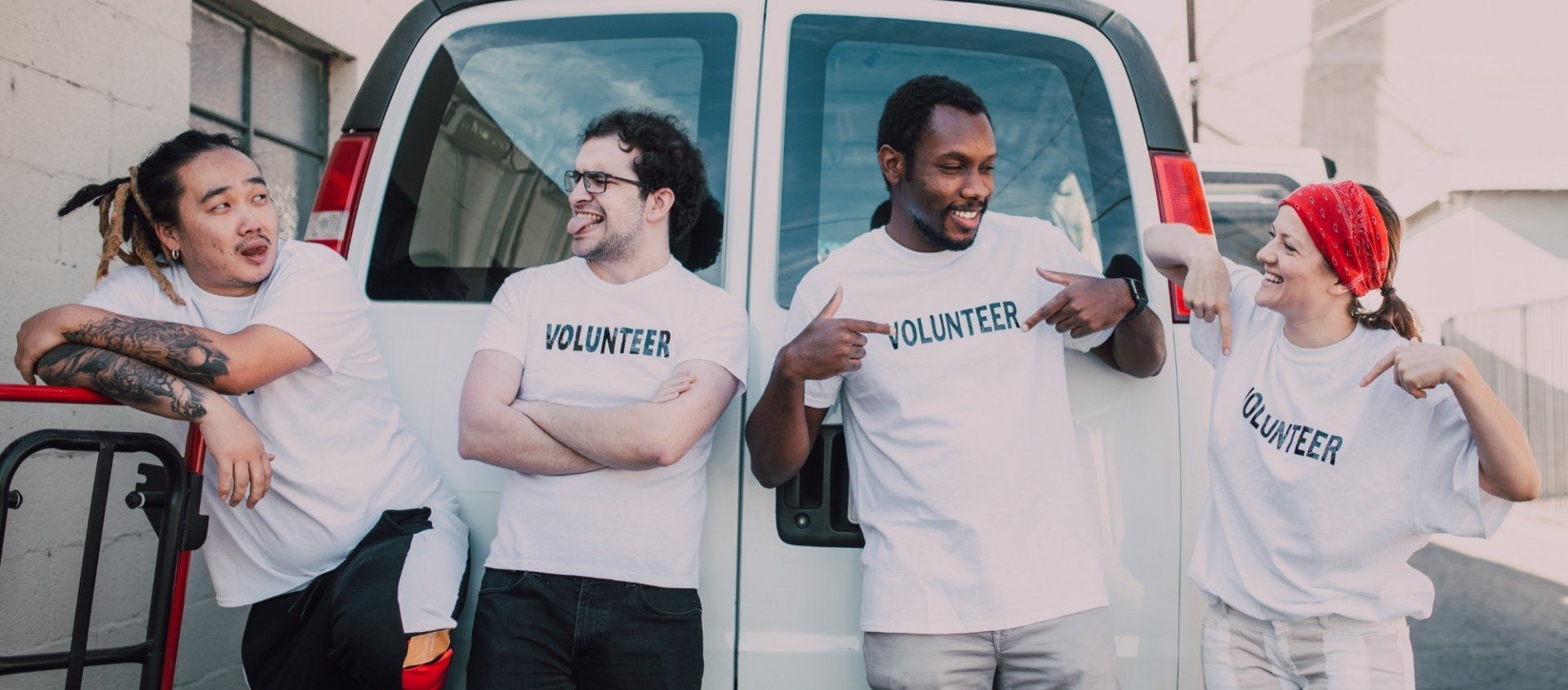 Four volunteers in white shirts with 