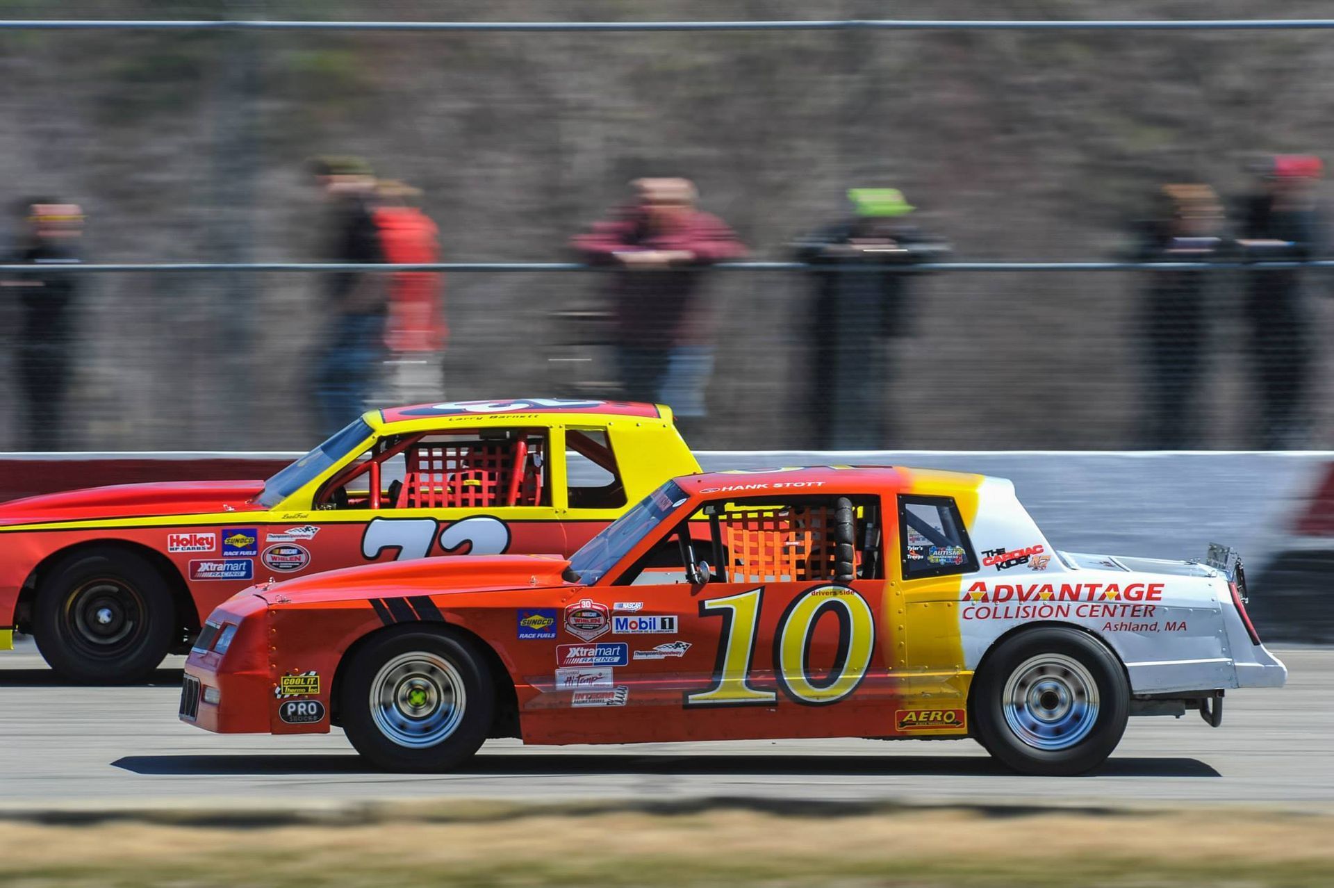 A red and yellow race car with the number 10 on it
