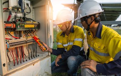 Electrician Working on Tester Measuring Voltage — Brownsville, TX — Gallegos Electric Inc.
