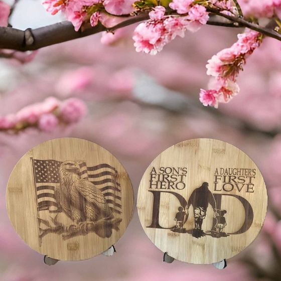 A son 's first hero and a daughter 's first love are engraved on two wooden coasters