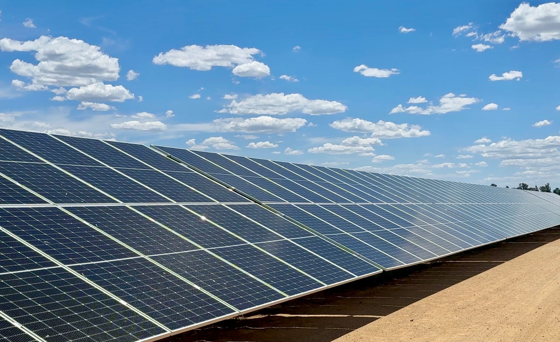 An aerial view of a building with solar panels on the roof