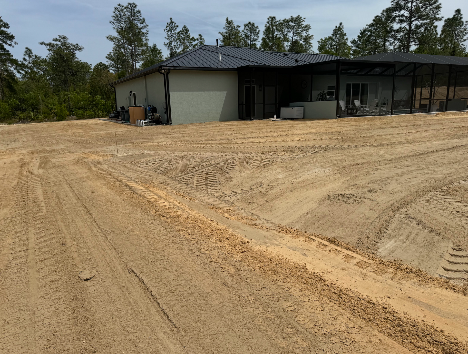 A house is being built in the middle of a dirt field