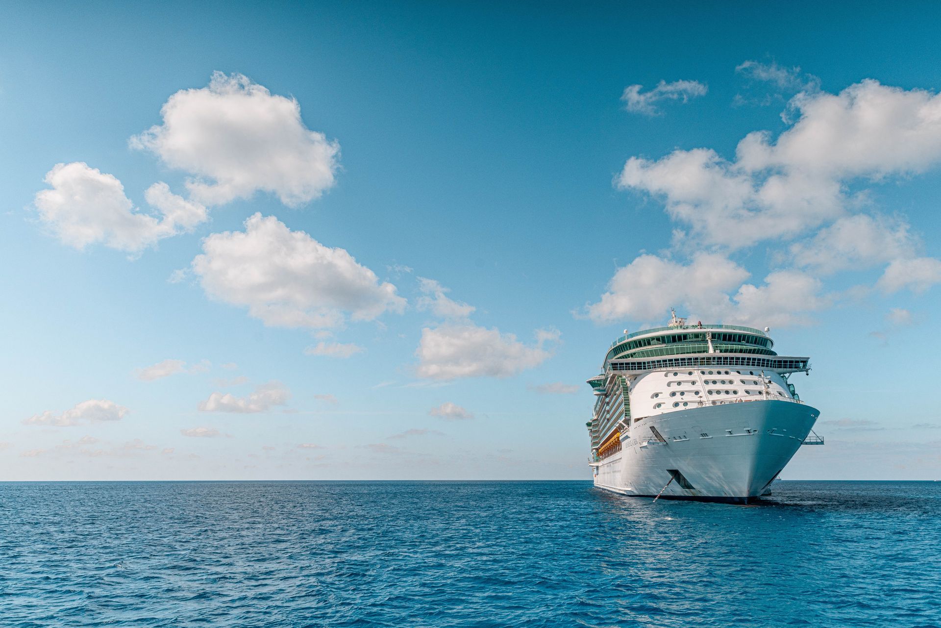 A cruise ship is floating on top of a large body of water.