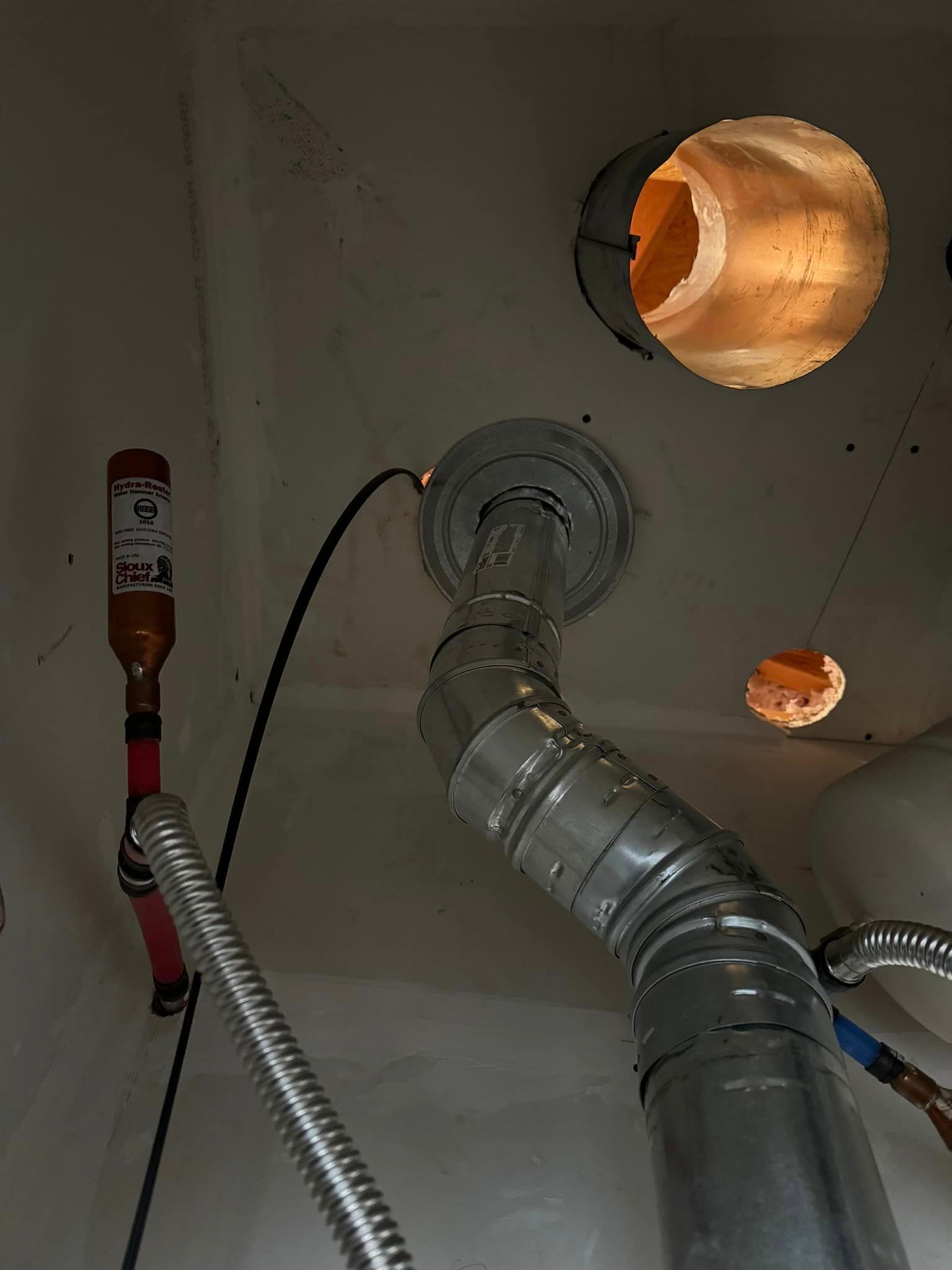 A close up of a pipe with a light coming out of it.