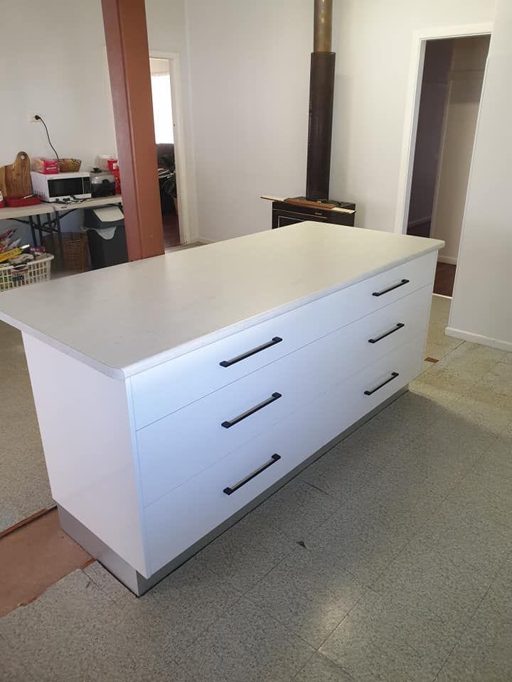 A Large White Island With Drawers in a Kitchen — Pacific Cabinets In Iluka, NSW