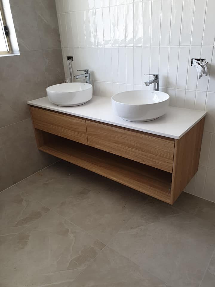 A Bathroom With Two Sinks and a Wooden Vanity — Pacific Cabinets In Evans Head, NSW