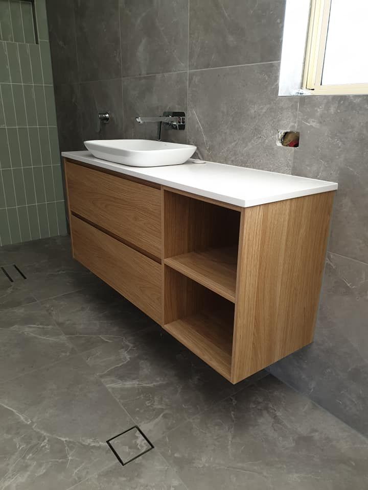 A Bathroom With a Wooden Vanity and a Sink — Pacific Cabinets In Yamba, NSW