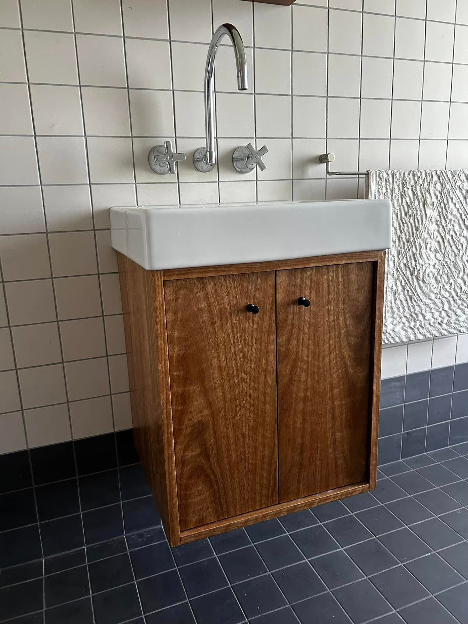 A Bathroom Sink With a Wooden Cabinet — Pacific Cabinets In Yamba, NSW