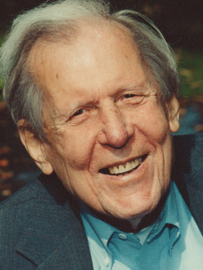 a man in a suit and tie is smiling for the camera Louis Savary PHD STD