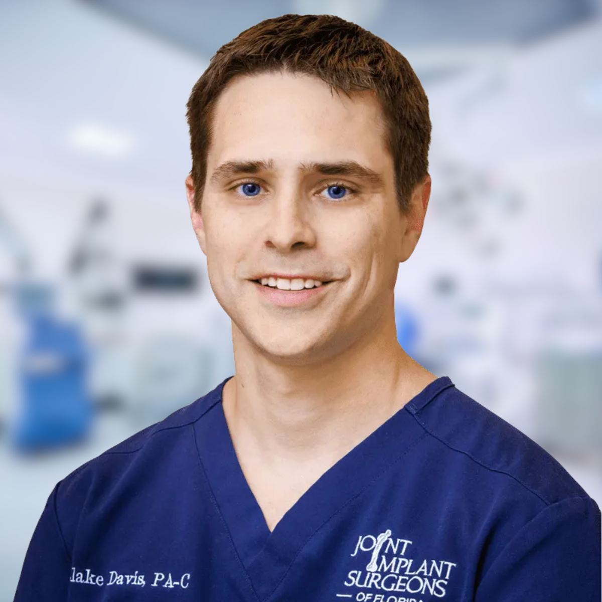 John Davis, P.A.-C., smiling in blue scrubs. Background is a blurred surgical setting.