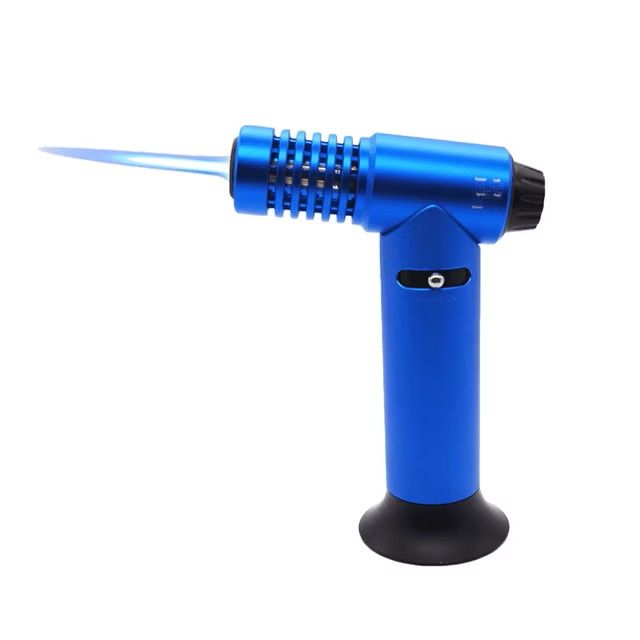 Blue handheld butane torch with a black base and flame nozzle, isolated on white background