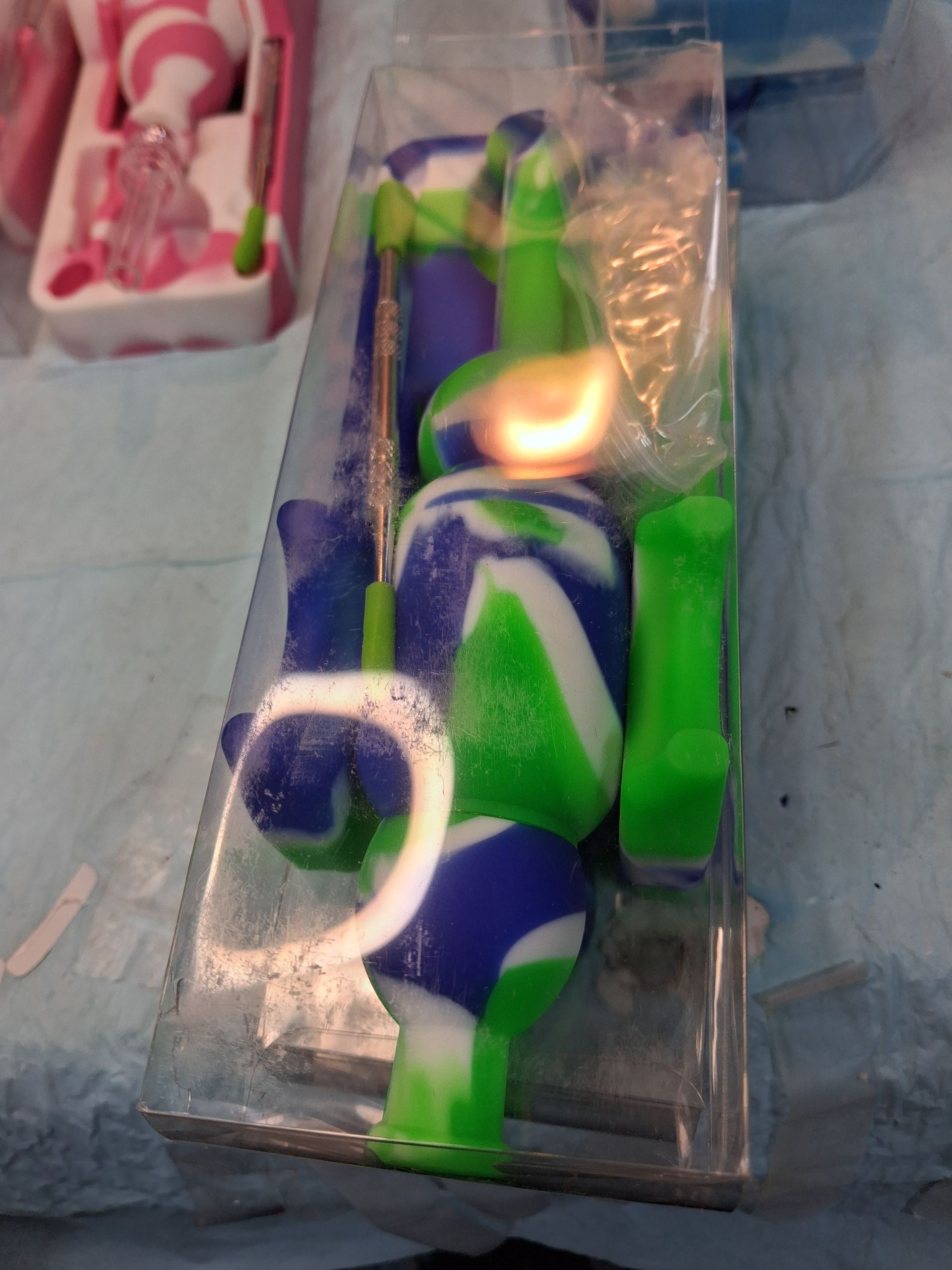Colorful toy figure in plastic packaging on a display table