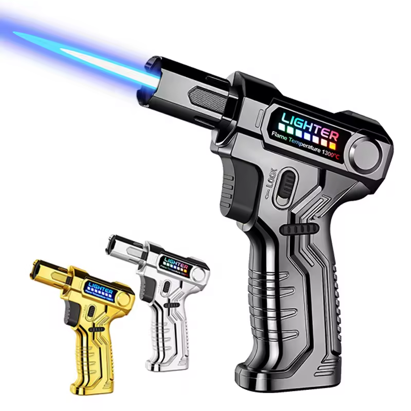Three toy lighter-shaped guns in black, gold, and silver, one blue flame lit