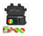 Colorful juggling/prop set in a black carrying case, with a hand holding a rainbow-striped item.