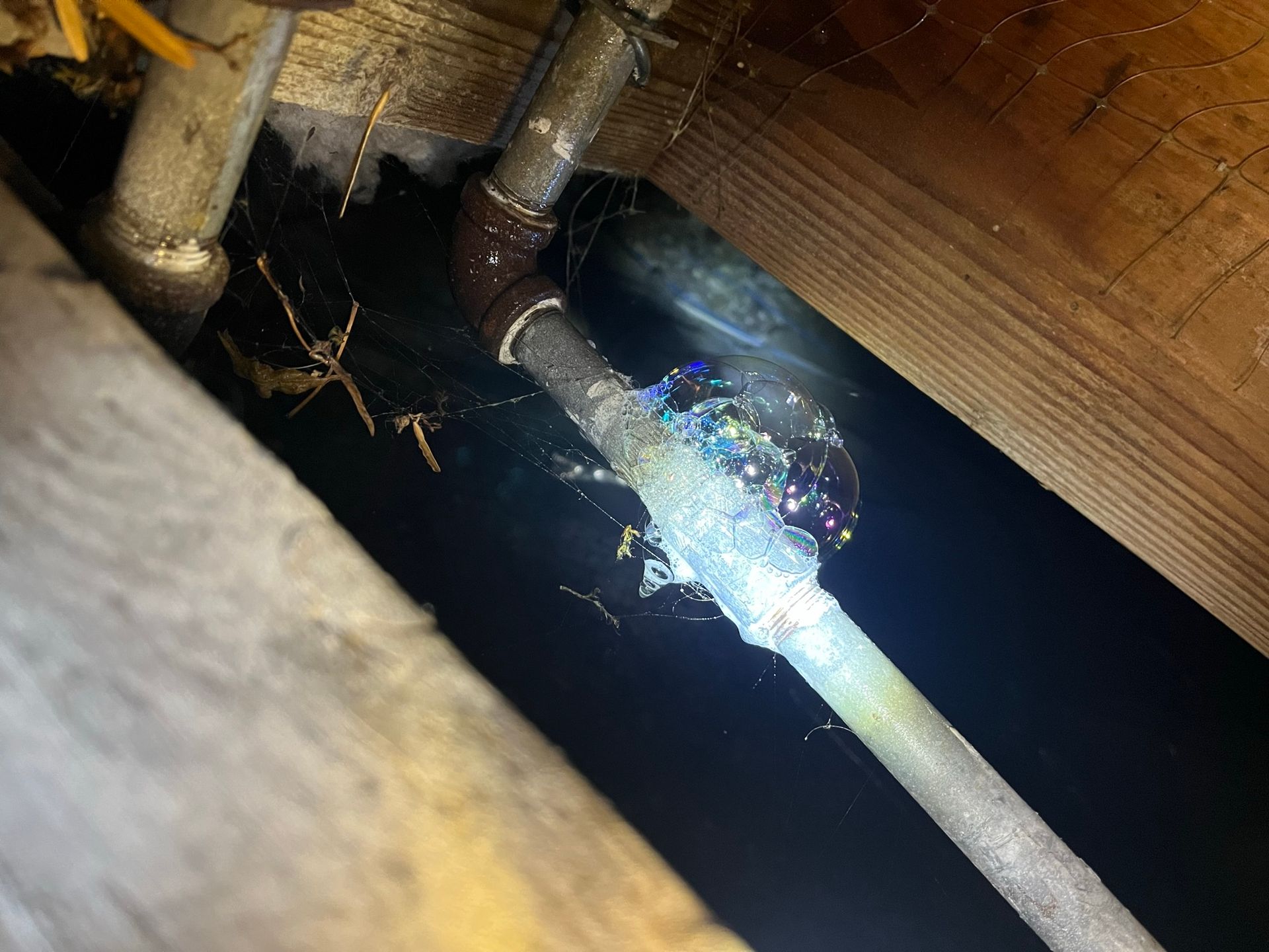 A close up of a pipe with water coming out of it.