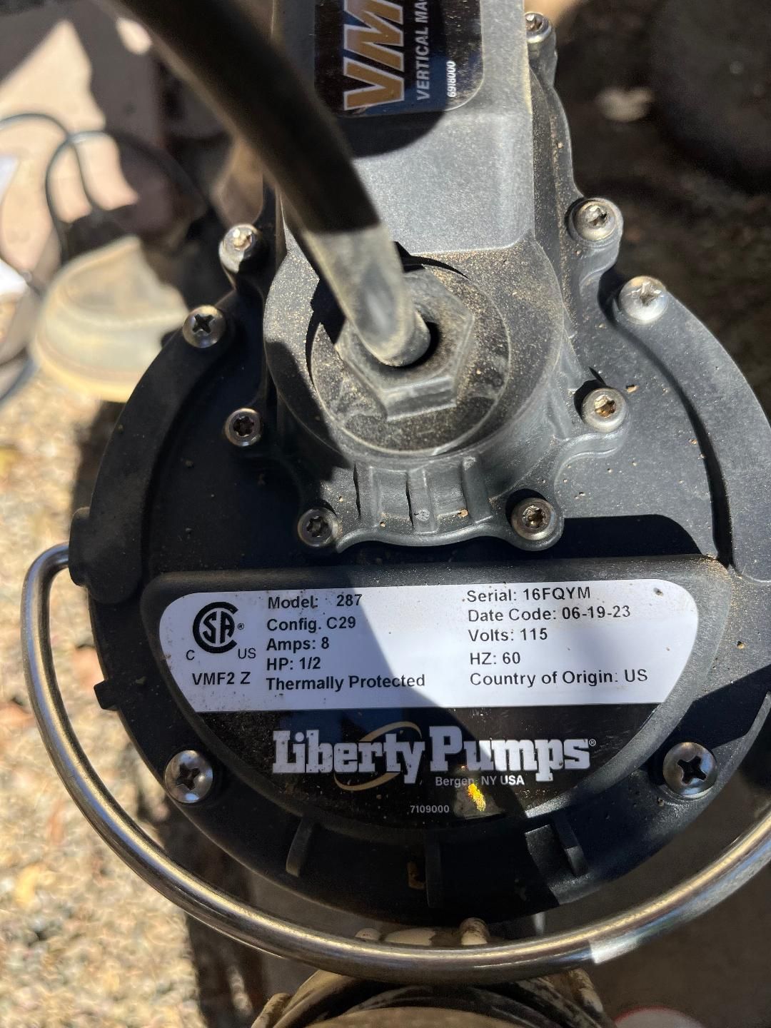 A close up of a liberty pump on the ground