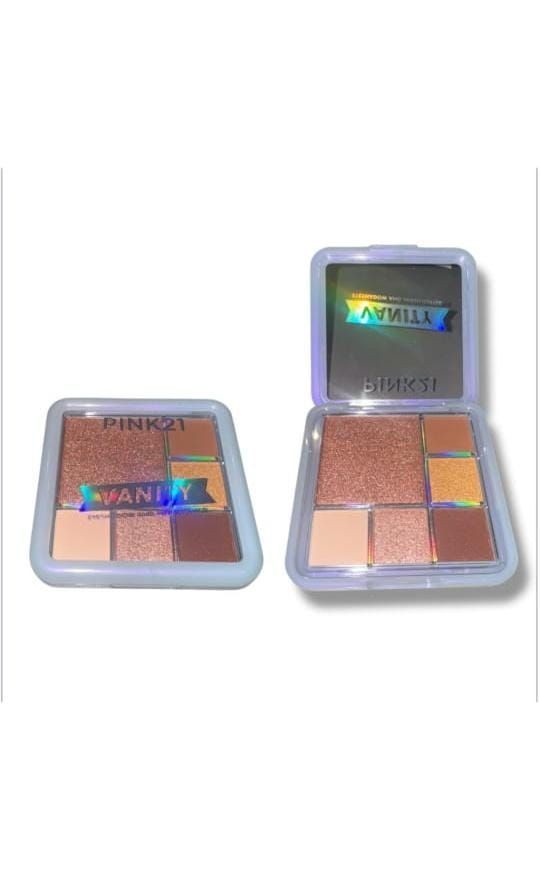 Dos paletas de sombras de ojos: una cerrada y otra abierta. Tonos marrones, dorados y rosas en un estuche transparente.