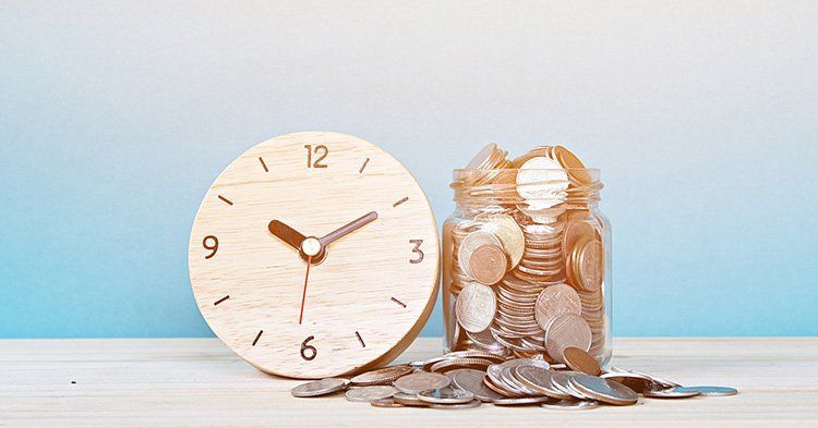 Clock Beside A Jar of Coins — Fishers, IN — Norwood Economics