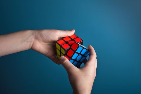 A Boy Playing Rubik's Cube — Fishers, IN — Norwood Economics