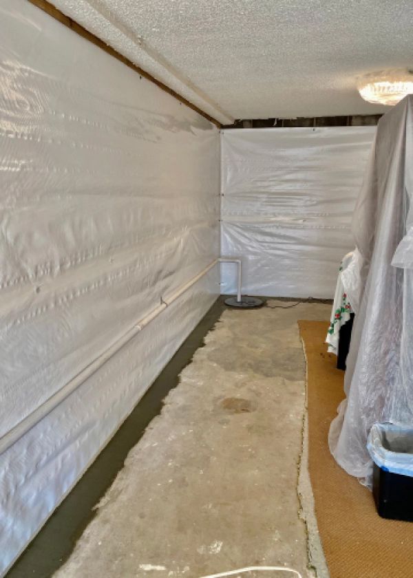 A room with a lot of white plastic on the walls and floor.