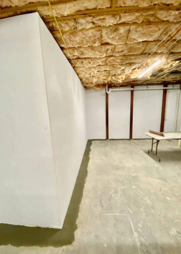 There is a table in the middle of the room.