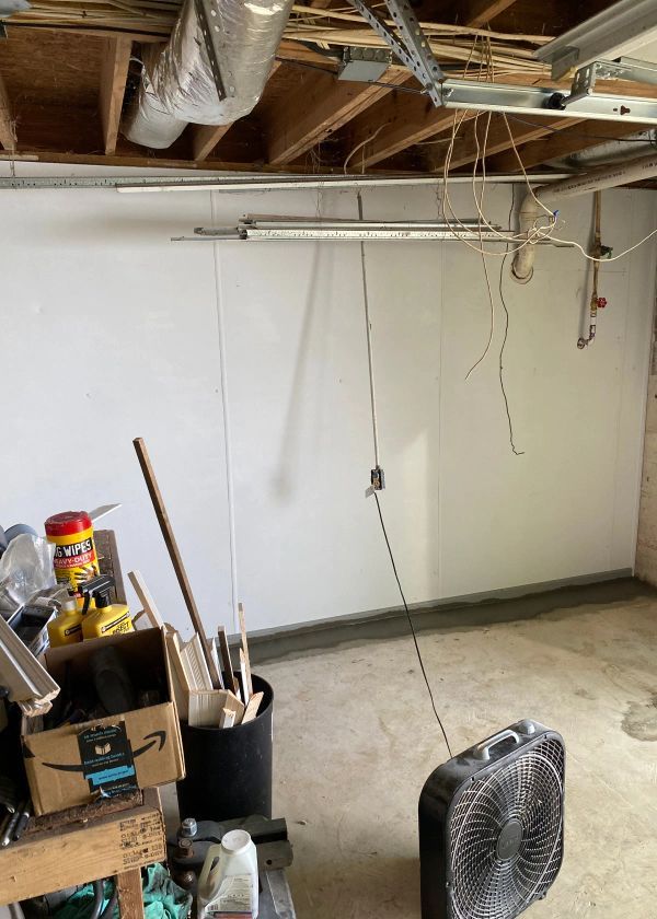 There is a fan in the middle of the room.