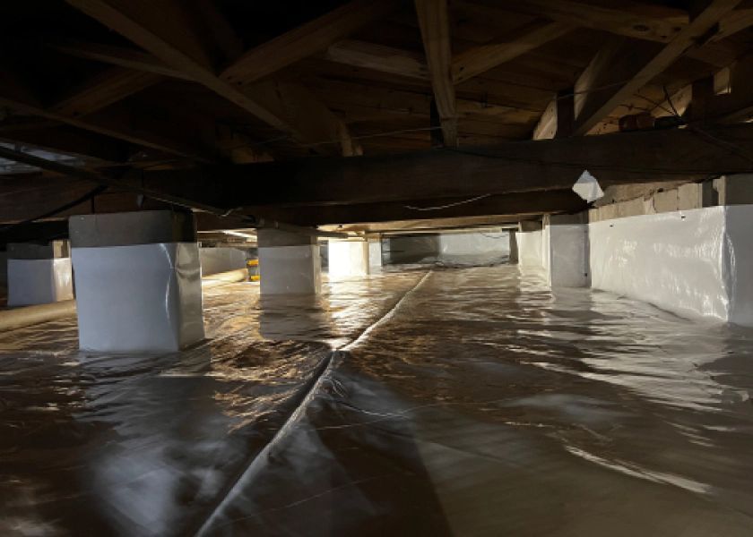 A flooded basement with a lot of water coming out of it.