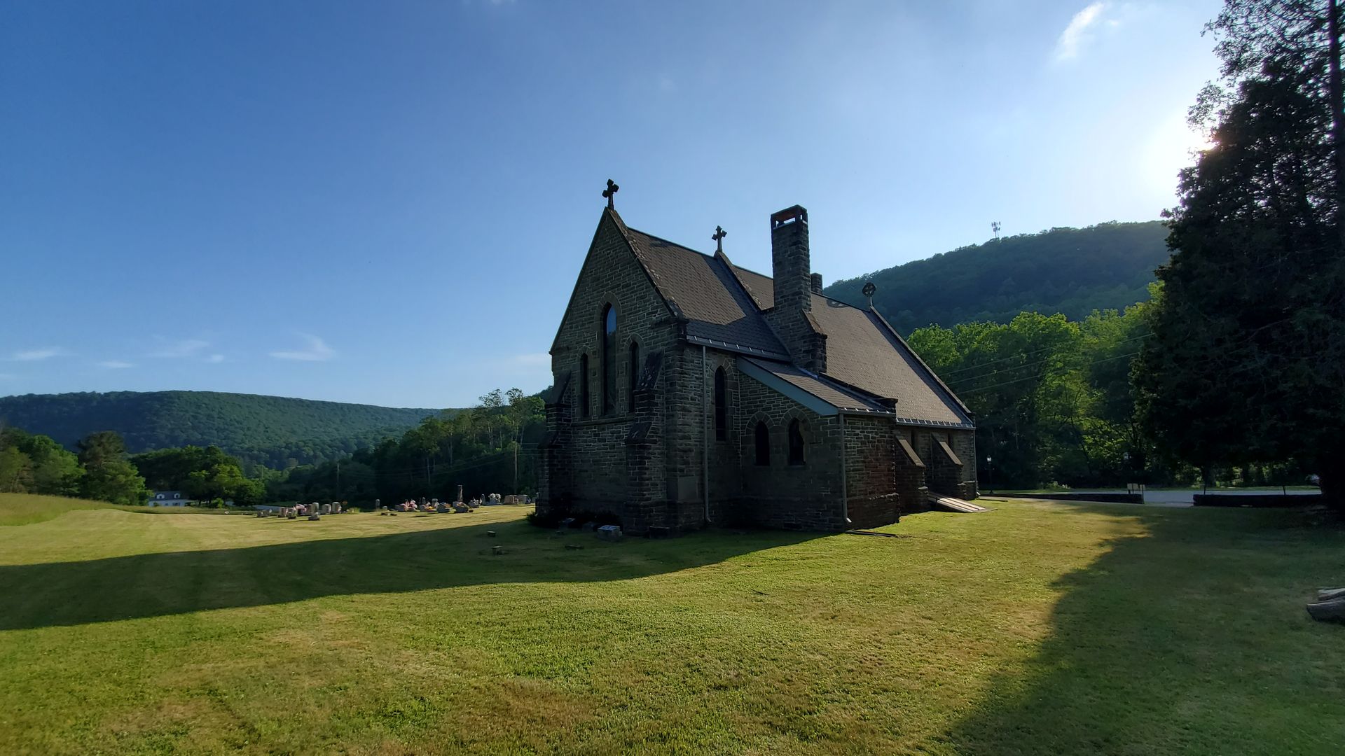 A church in the middle of a grassy field