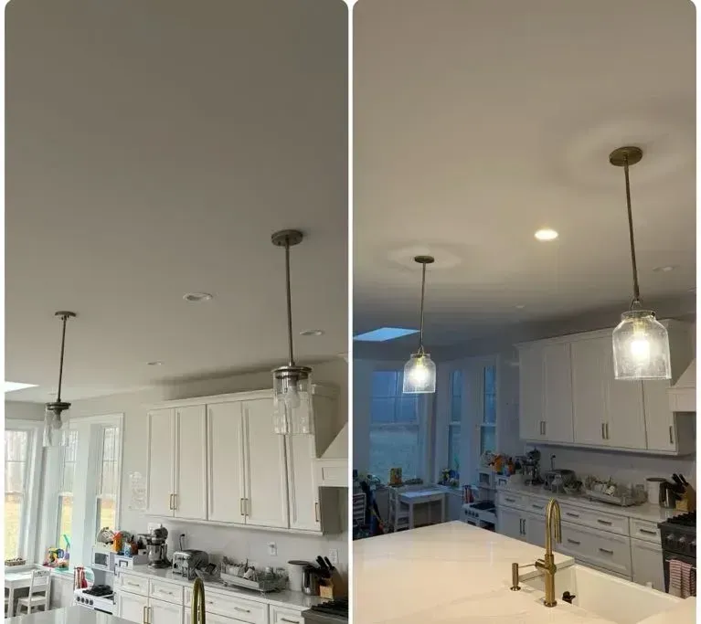 Split-view kitchen with white cabinets, island sink, and pendant lights under a white ceiling.