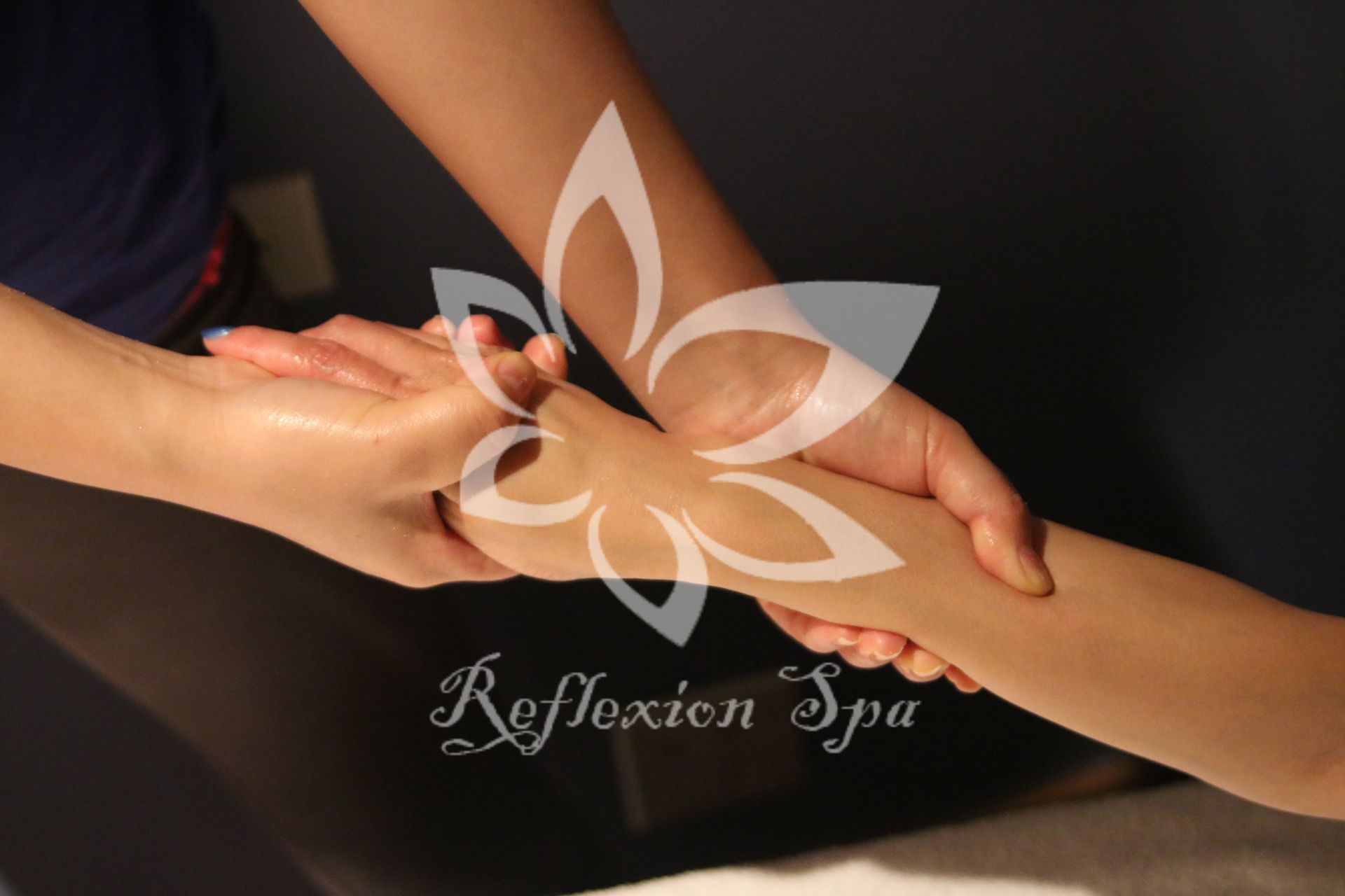 A person is getting a massage at a reflexion spa