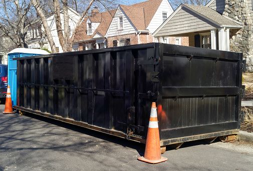 black dumpster for resident project in Lafayette LA