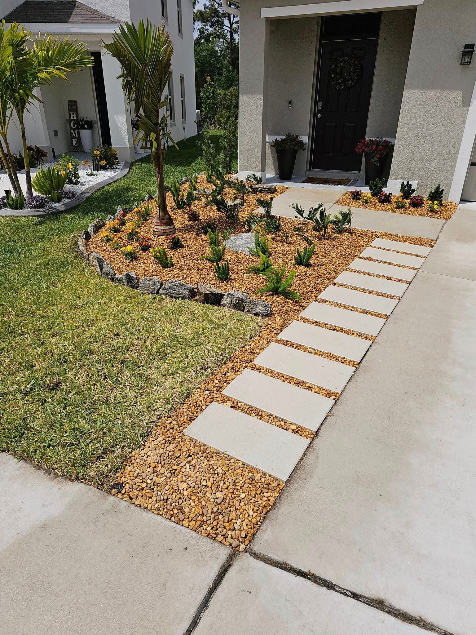 Front yard landscaping with irrigation system, mulch beds, and plant installation in Plant City, FL