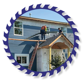 Two men are working on the roof of a house