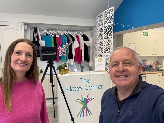 Emma and Peter in front of a Matterport camera whilst scanning a Pilates Studio