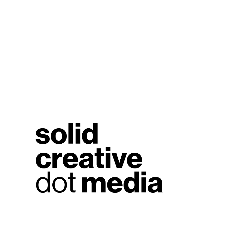 A black and white logo for solid creative dot media.
