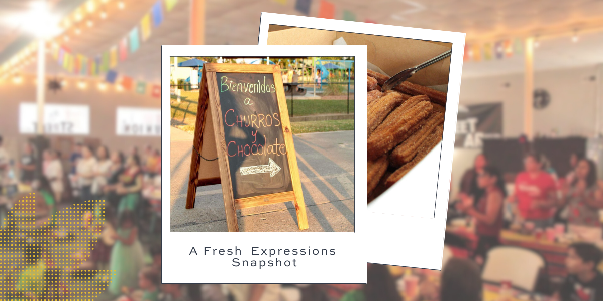 A camera displaying a room with people at tables, possibly at a meeting or event.