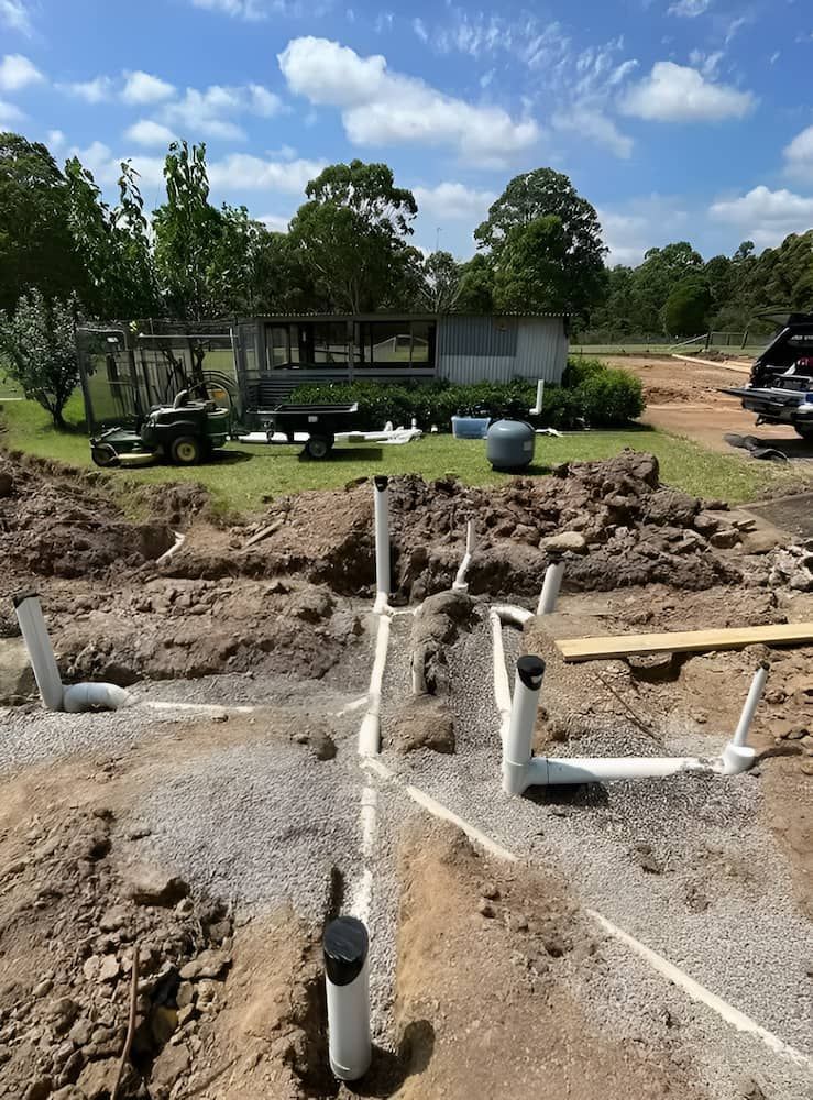 Plumbing Pipes Laid in Trenches at a Construction Site and Outdoors — Primed Plumbing & Gasfitting in Eglinton, NSW