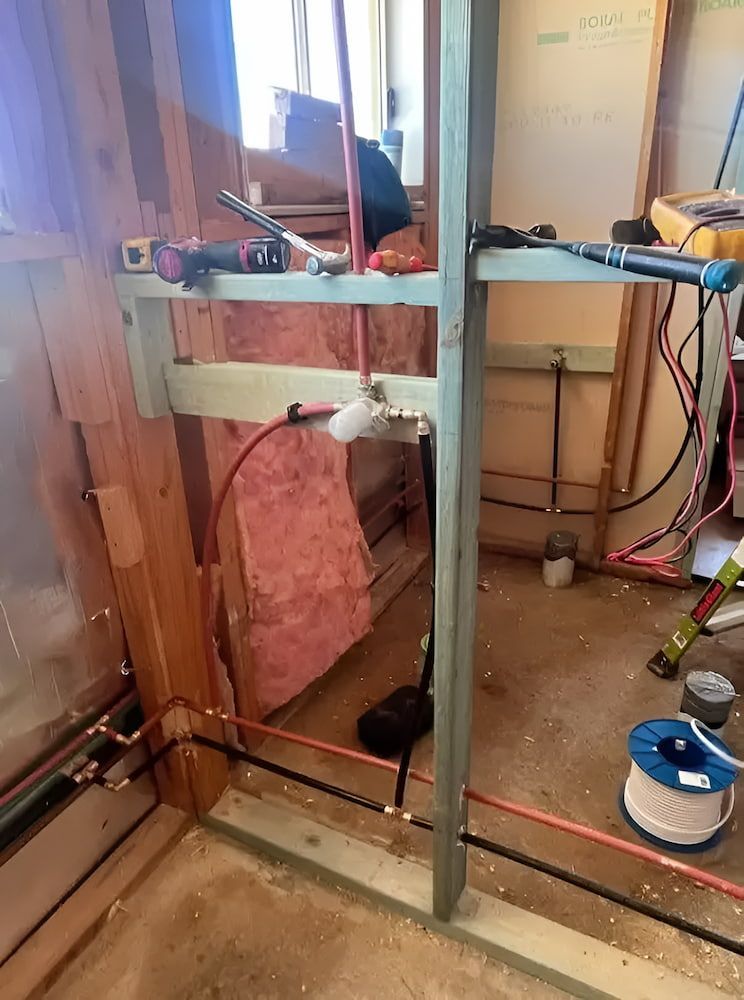 Construction Site With Wooden Framing, Copper Pipes, and Insulation — Primed Plumbing & Gasfitting in Eglinton, NSW
