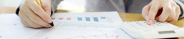 Man analyzing financial reports — Accounting Services in Eugene, OR