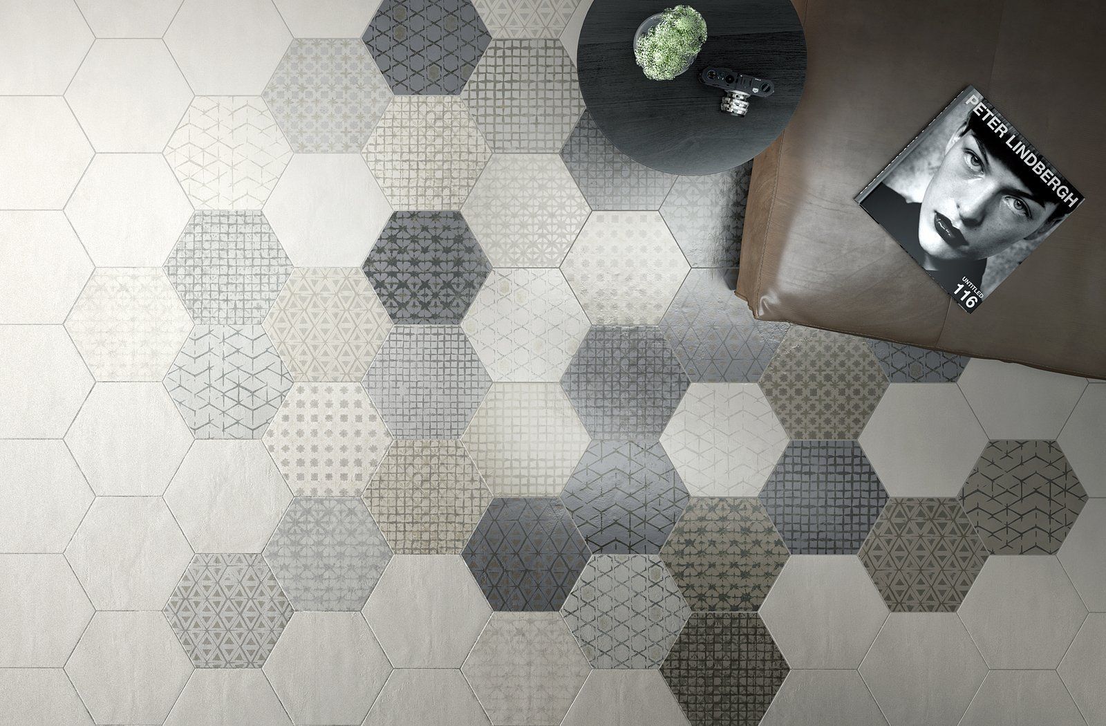 A hexagon tile floor with a table and a magazine on it.