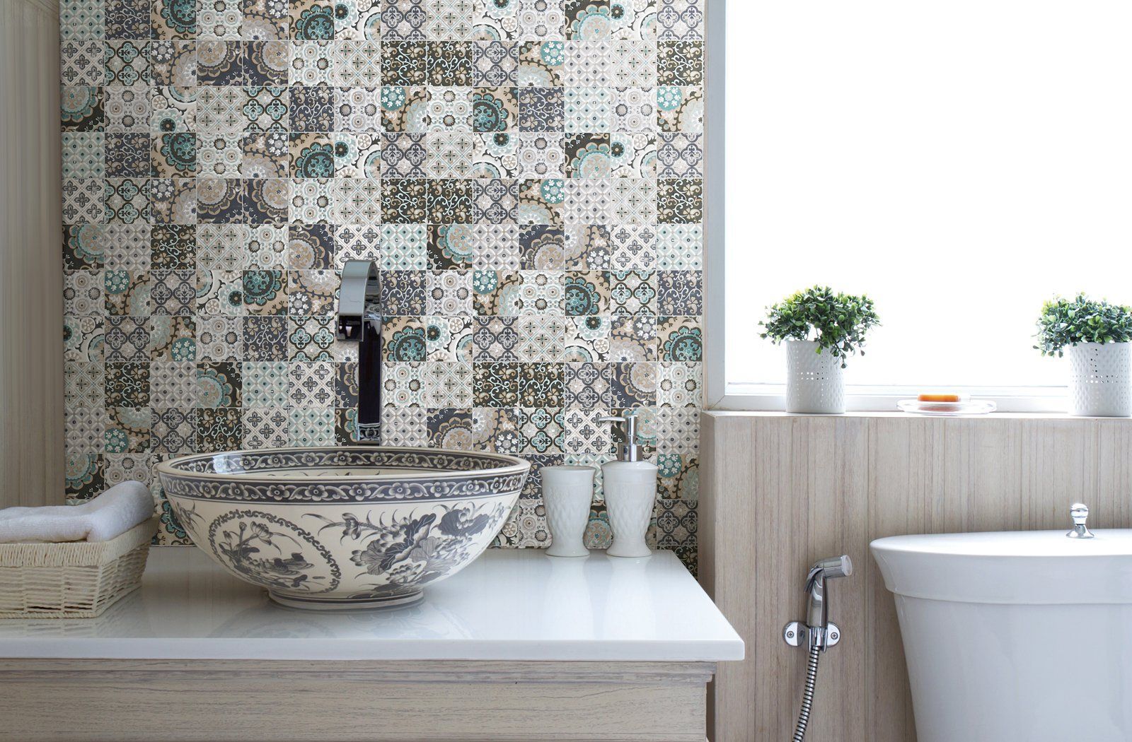 A bathroom with a sink , tub , and window.