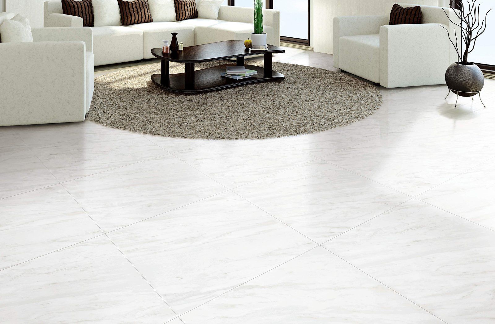 A living room with white furniture and a coffee table