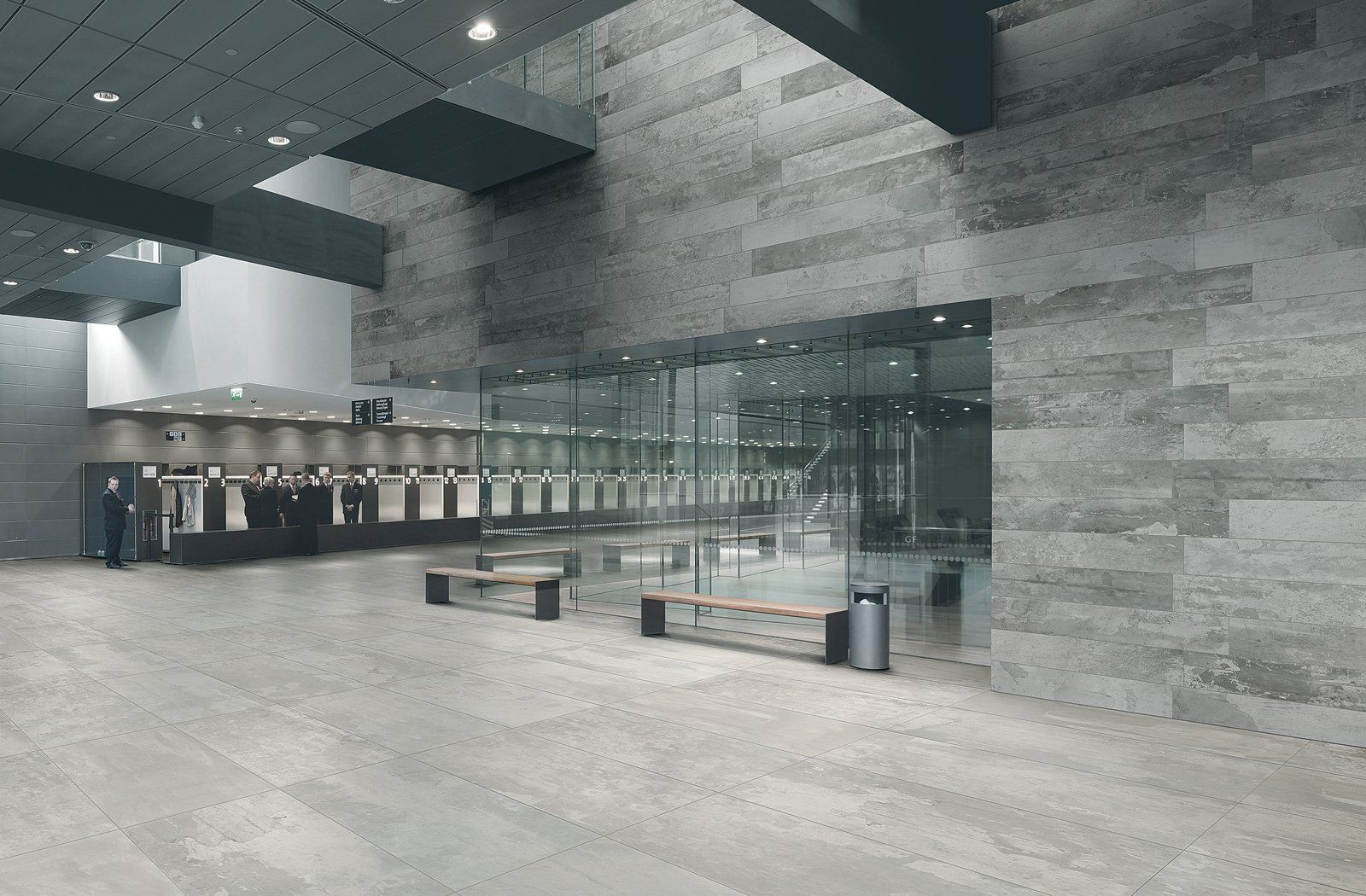 A large building with a lot of windows and benches