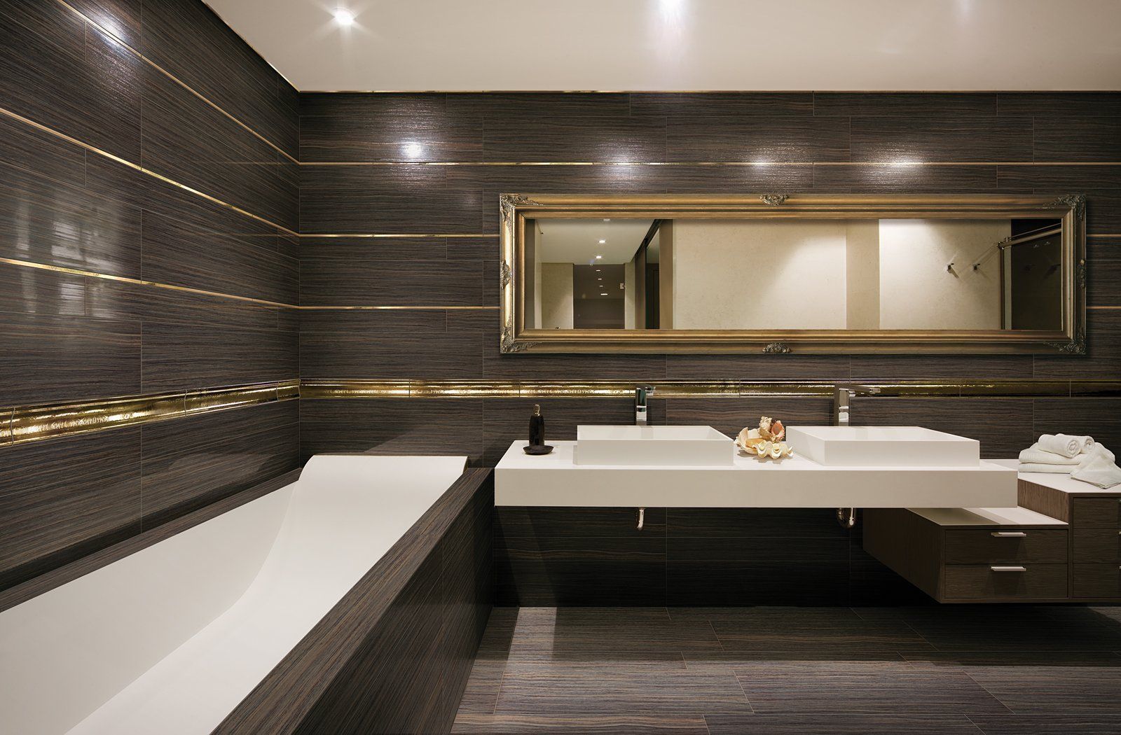 A bathroom with two sinks and a large mirror